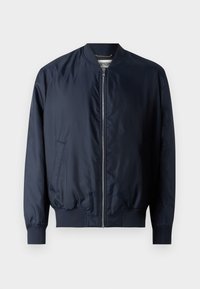 Marine bomberjakke med en glatt, shiny finish, ribbestrikkede mansjetter og hem, har glidelås foran og sidelommer.