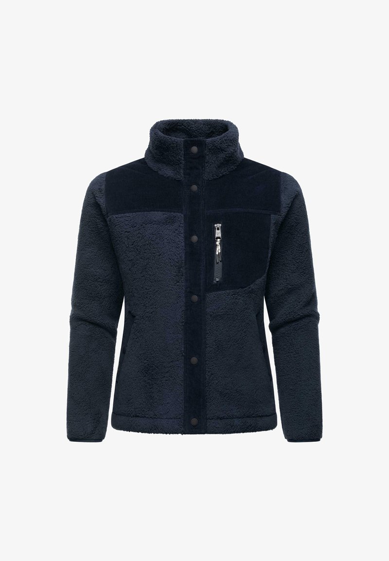 Giacca in pile blu navy con una superficie morbida e testurizzata. Presenta un pannello in cotone a costine, colletto alto, bottoni a pressione e una tasca sul petto con zip.