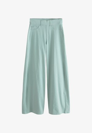 Pantalon large bleu clair avec poches avant, passants de ceinture et taille mi-haute, présenté sur un fond blanc.