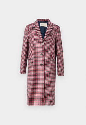 Ruuduline mantel punases, valges ja sinises. Omab lõikega kaelust, ees nuppe ja kahte külge taskut. Valmistatud tekstuuriga kangast.