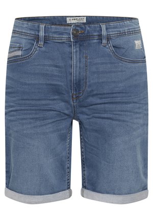 Denim shorts in a medium blue shade, featuring a rolled hem, five pockets, and contrasting yellow stitching. Label reads "11 PROJECT."