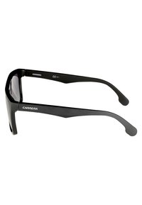 Black sunglasses with a sleek frame design, featuring a matte finish, wide arms, and a logo on the front. Tinted lenses for UV protection.