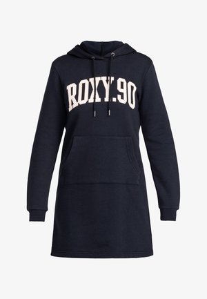 Vestido sudadera azul marino con mangas largas, bolsillo frontal tipo canguro, capucha con cordón y texto blanco "ROXY.90" en el pecho.