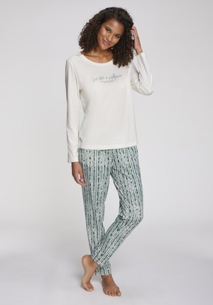 Ljusgrön långärmad topp med text, ihop med randiga gröna pyjamasbyxor. Mjuk tyg, avslappnad passform och enkel design.