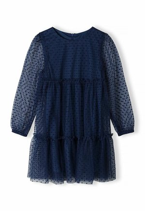 Navy blue long-sleeve dress with sheer polka dot overlay, ruffled waist and hem, and a back zipper closure.