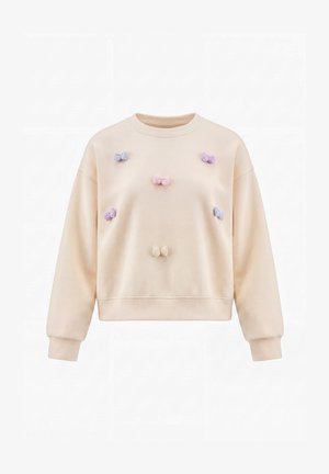 Beige sweatshirt med lange ærmer, dekoreret med små pastelfarvede sløjfer i lilla, lyserød og creme på forsiden. Ingen person er vist.