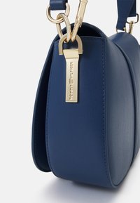 Tommy Hilfiger HERITAGE SADDLE BAG - Rankinė - fossil blue