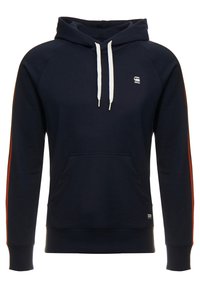 Felpa con cappuccio blu navy, con lacci bianchi, tasca a marsupio frontale e sottili strisce rosse lungo le maniche.