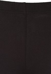 Czarne legginsy z gładkiego, elastycznego materiału o żeberkowanej strukturze. Pas jest bezszwowy, co zapewnia komfort i elastyczność.