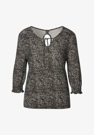 Zwart-wit gespikkelde blouse met lange mouwen, ronde hals, keyhole uitsnijding en strikdetail, met gerafelde manchetten.