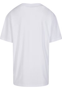 En enkel hvit T-skjorte med korte ermer, vist bakfra med rund hals og uten synlig design eller tekst.