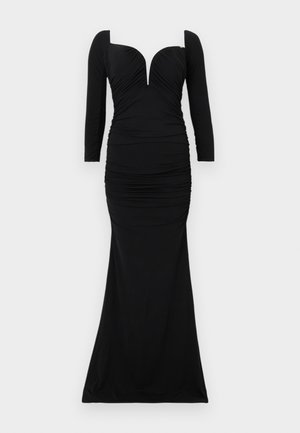 Μακρύ μαύρο βραδινό φόρεμα με τετράγωνη λαιμόκοψη, μακριά μανίκια, εφαρμοστό σουρωτό κορσέ και στενή φούστα που ανοίγει ελαφρώς στο τελείωμα.