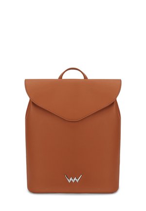 Brown leather backpack with a flap closure, a top handle, and a silver logo accent at the bottom. Smooth texture and minimalist design.