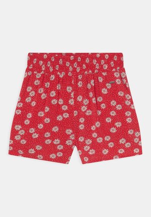 Pantaloncini rossi con motivo floreale di margherite bianche e gialle e piccoli puntini bianchi, con vita elastica e tasche laterali.