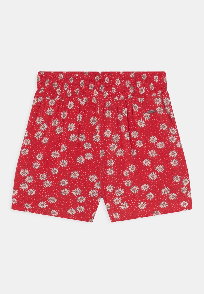 Shorts rouges avec motif floral de marguerites blanches et jaunes et petits points blancs, avec une taille élastique et des poches latérales.