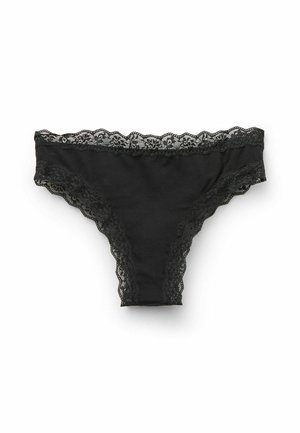 Tanga de algodón negro con detalles de encaje en la cinturilla y las aberturas de las piernas, con bordes scalloped y una textura suave.