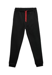 Sorte sweatpants lavet af blødt stof med en rød snøre i taljen. Har sidelommer og ribbede manchetter ved anklerne.