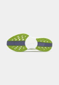 Shoe outsole featuring a white base, bright green textured rubber for grip, and a gray section with embossed branding.