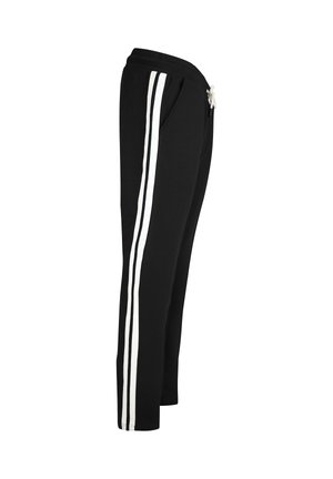 Schwarze Sweatpants mit weißen Seitenstreifen, elastischem Bund und Kordelzug. Der Stoff ist weich und leicht strukturiert. Mit zwei Seitentaschen.