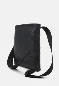 Calvin Klein Jeans MONOGRAM SOFT FLATPACK UNISEX - Borsa a tracolla - black