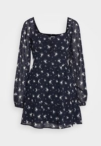 Mörkblå blommig klänning i genomskinligt material, med långa puffärmar, fyrkantig halsringning, knytfrontdetalj och utsvängd volangnederkant.