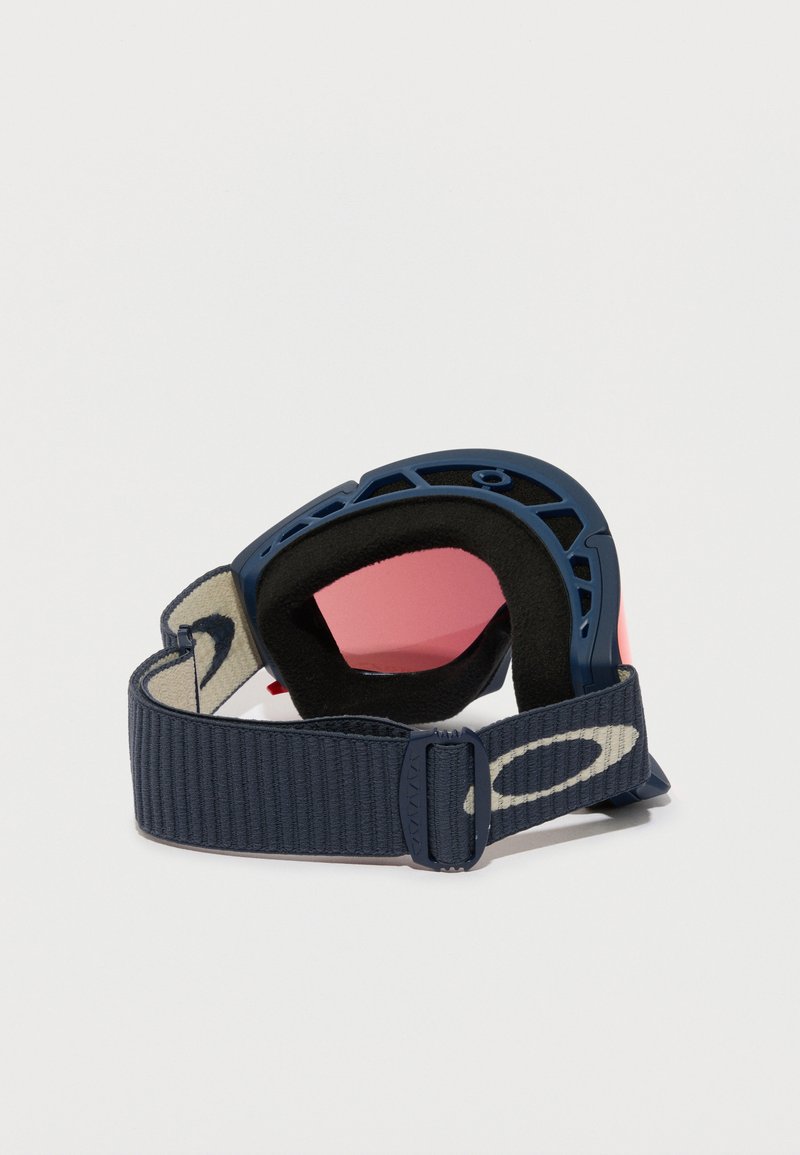 Skibriller med en blå ramme, pink linser og en m�ørk stofrem med et logo. Blød polstring omgiver linserne for komfort.