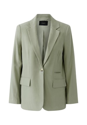 Lichtgroene damesblazer met één knoop, revers met inkeping, twee voorzakken met klep en een zwart binnenlabel met de tekst "oui".