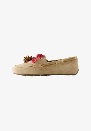 Tan suede loafer with red and brown decorative laces, moc toe stitching, and rubber sole, shown in side profile.