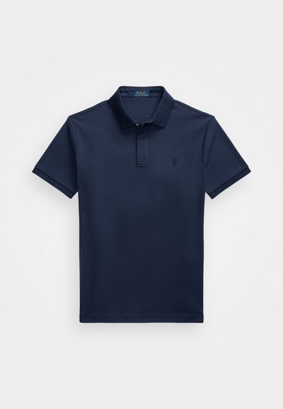Navy blue cotton polo shirt with a collar, short sleeves, two buttons, and a small embroidered logo on the left chest. Smooth texture.