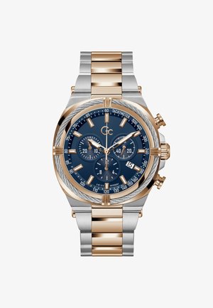 Zegarek ze stali nierdzewnej w kolorze srebrnym i różowego złota z niebieską tarczą, trzema subtarczami, skalą tachymetru oraz szczotkowaną bransoletą z polerowanymi akcentami.