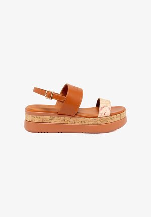 Brown leather platform sandals with adjustable ankle strap, cork-like midsole, and textured footbed. Upper features a contrasting strap.