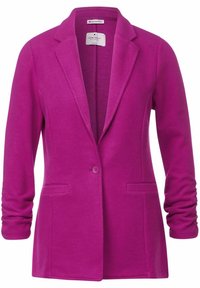 Fuchsiová blazerka vyrobená z měkké tkaniny, s klopovým límcem, jedním knoflíkem a dvěma předními kapsami pro elegantní design.