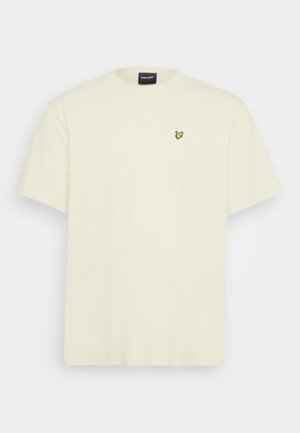 T-shirt a maniche corte, di colore crema chiaro, realizzato in cotone. Presenta una tasca e un piccolo logo a farfalla gialla sul petto. Collo rotondo.