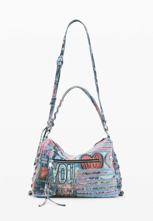 Sac à épaule avec bandoulière réglable, imprimé multicolore style graffiti, poche avant zippée et textes visibles incluant "YOU" et des cœurs.