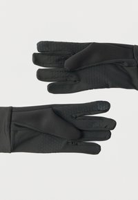 Μαύρα γάντια με πλήρη δάχτυλα και υφασμένα σχέδια λαβής στις παλάμες και τα δάχτυλα, τοποθετημένα επίπεδα που παρουσιάζουν και τις δύο πλευρές, μπροστινή και πίσω.