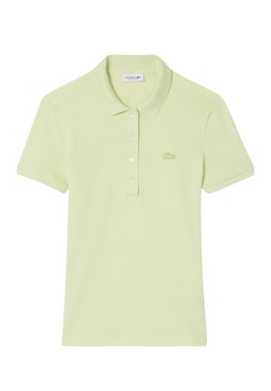 Polo a maniche corte verde chiaro, con patta a bottoni e piccolo logo Lacoste ricamato sul petto. Realizzata in tessuto strutturato.