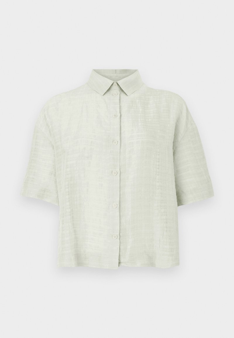 Kortærmet lysegrøn skjorte lavet af tekstureret stof, med knapper foran og klassisk kravedesign.
