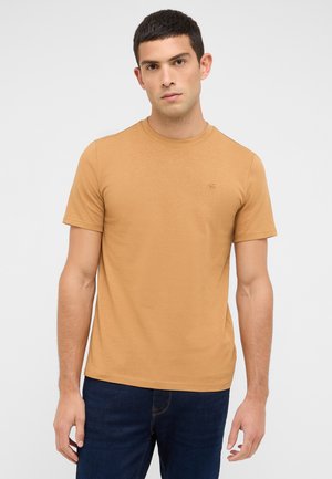 Kurzärmeliges T-Shirt mit Rundhalsausschnitt in einem einfarbigen Hellbraun. Hergestellt aus Baumwolle mit glatter Textur. Kleines Logodetail auf der Brust.