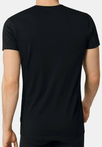 Black short-sleeve t-shirt made of soft cotton. Features a classic crew neckline and a straight cut. Minimalistic design with no visible patterns.