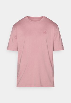 Lyserød kortærmet t-shirt i bomuld med rund halsudskæring. Har en lille logo på brystet og en mærkat på venstre ærme.