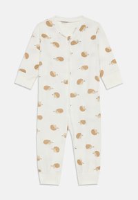 Weißer Stoff-Overall mit einem wiederholten Igelmuster in Beige und Braun. Er hat einen Reißverschluss vorne und eng anliegende Bündchen an den Ärmeln und Knöcheln.