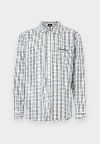 Καρό πουκάμισο με κουμπιά σε λευκό, πράσινο και μπλε. Διαθέτει μακριά μανίκια, γιακά, δύο εμπρόσθιες τσέπες και κέντημα λογοτύπου στο στήθος.