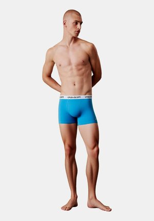 Modre bombažne bokserice s belim pasom, na katerem je napis "LYLE & SCOTT"; prilegajoč se kroj in mehak tekst.