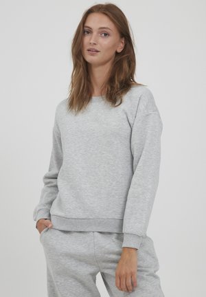 Gray cotton sweatshirt with a crew neckline and ribbed cuffs, featuring a relaxed fit and soft texture. Smooth fabric with no visible patterns.