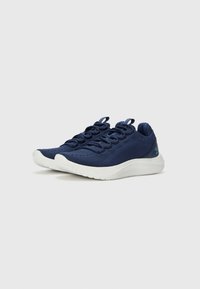 Blue knitted athletic shoes with a textured upper, white rubber outsole, and lace-up closure. Features a pull tab at the heel for easy wear.