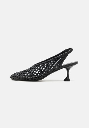 Black open-toe slingback heel made of a woven synthetic material, featuring a pointed toe and a slender, curved heel.