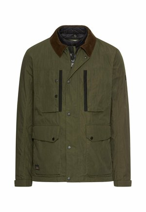 Olijfgroene jas met een corduroy kraag, voorzakken, zwarte accenten en een gestructureerde stof. Beschikt over een rits- en drukknoopsluiting.