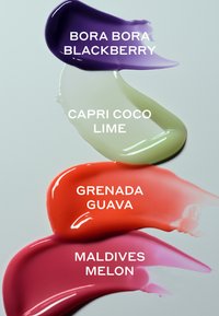 Four colorful paint swatches labeled Bora Bora Blackberry purple, Capri Coco Lime light green, Grenada Guava coral, and Maldives Melon pink on a white background.