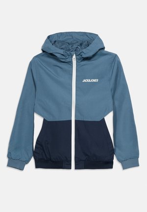 Blue and navy hooded jacket with front zipper, elastic cuffs, and "JACK&JONES" logo on the chest.