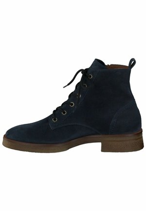 Navy suede ankle boots with a round toe, lace-up front, metal eyelets, and a brown textured rubber sole. Reinforced heel for support.